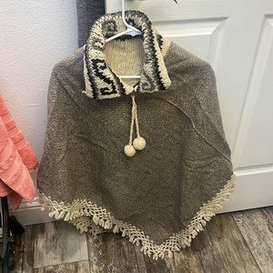 A grey/brown/beige, size Small, Poncho.